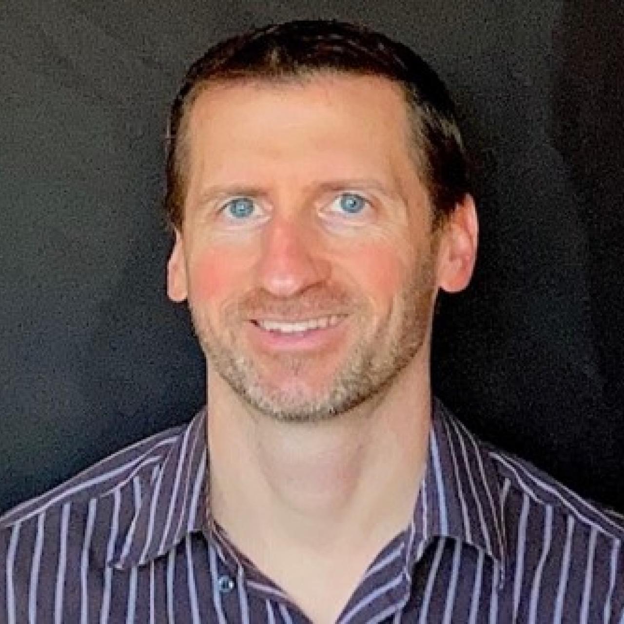 Mike poses for a headshot
