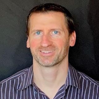 Mike poses for a headshot